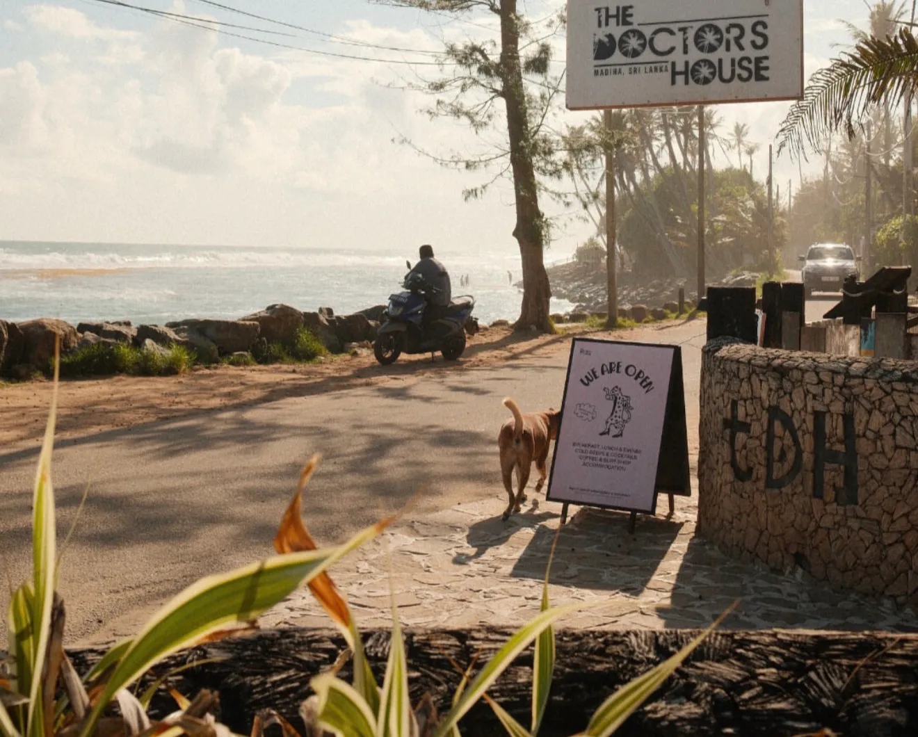 The Doctor’s House sign and entrance on the beach road in Madiha