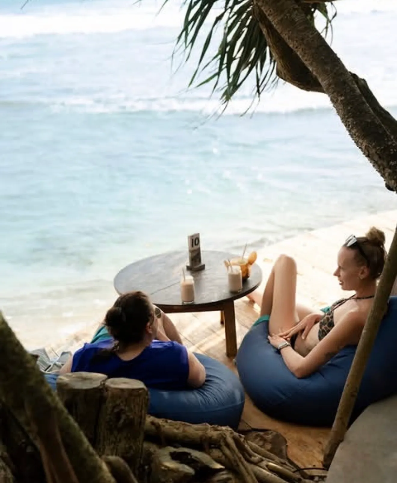 Two guests relaxing on beanbags on the beach deck at Hakuna Matata, Ahangama